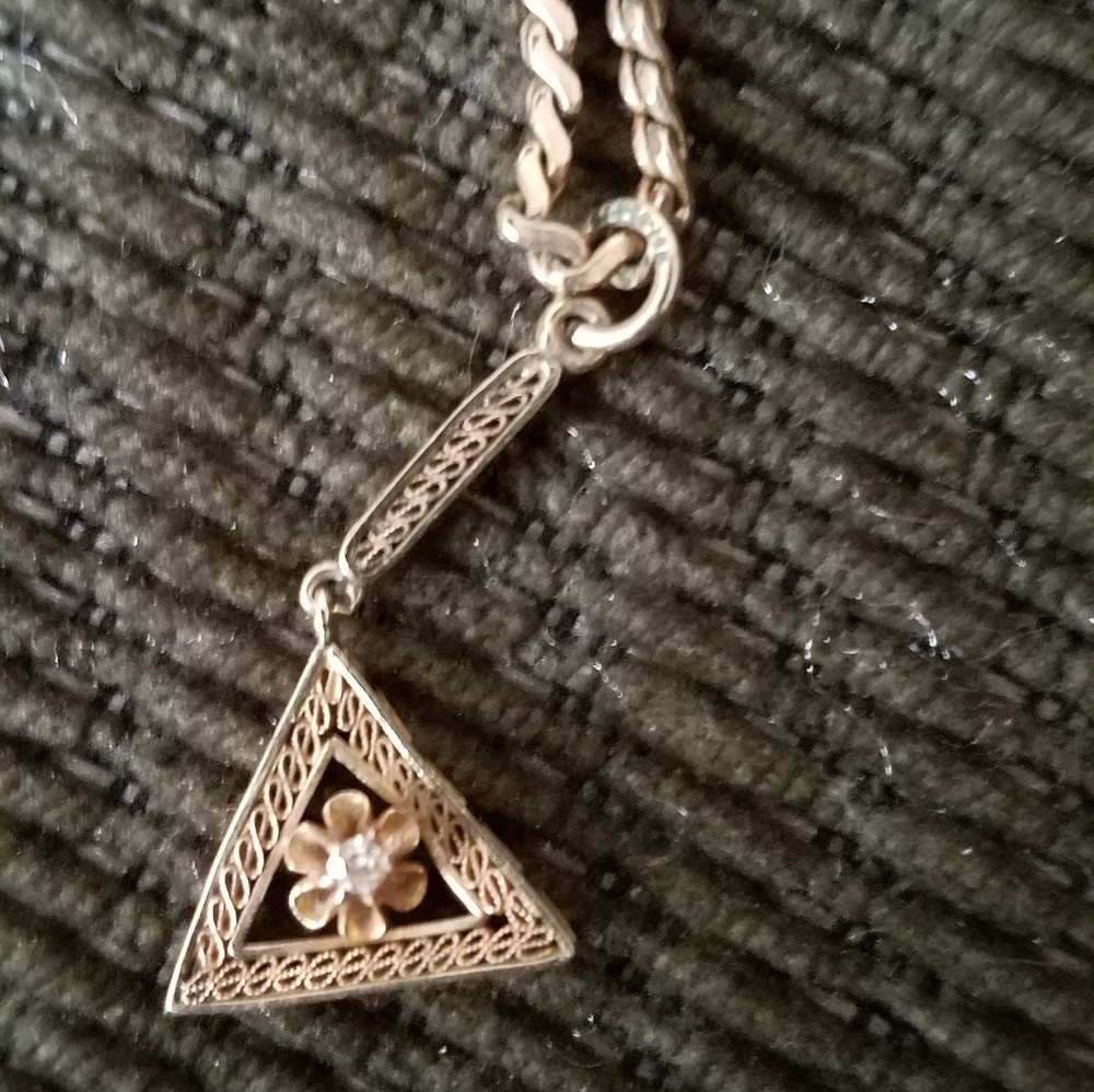 Gold flower in triangle choker